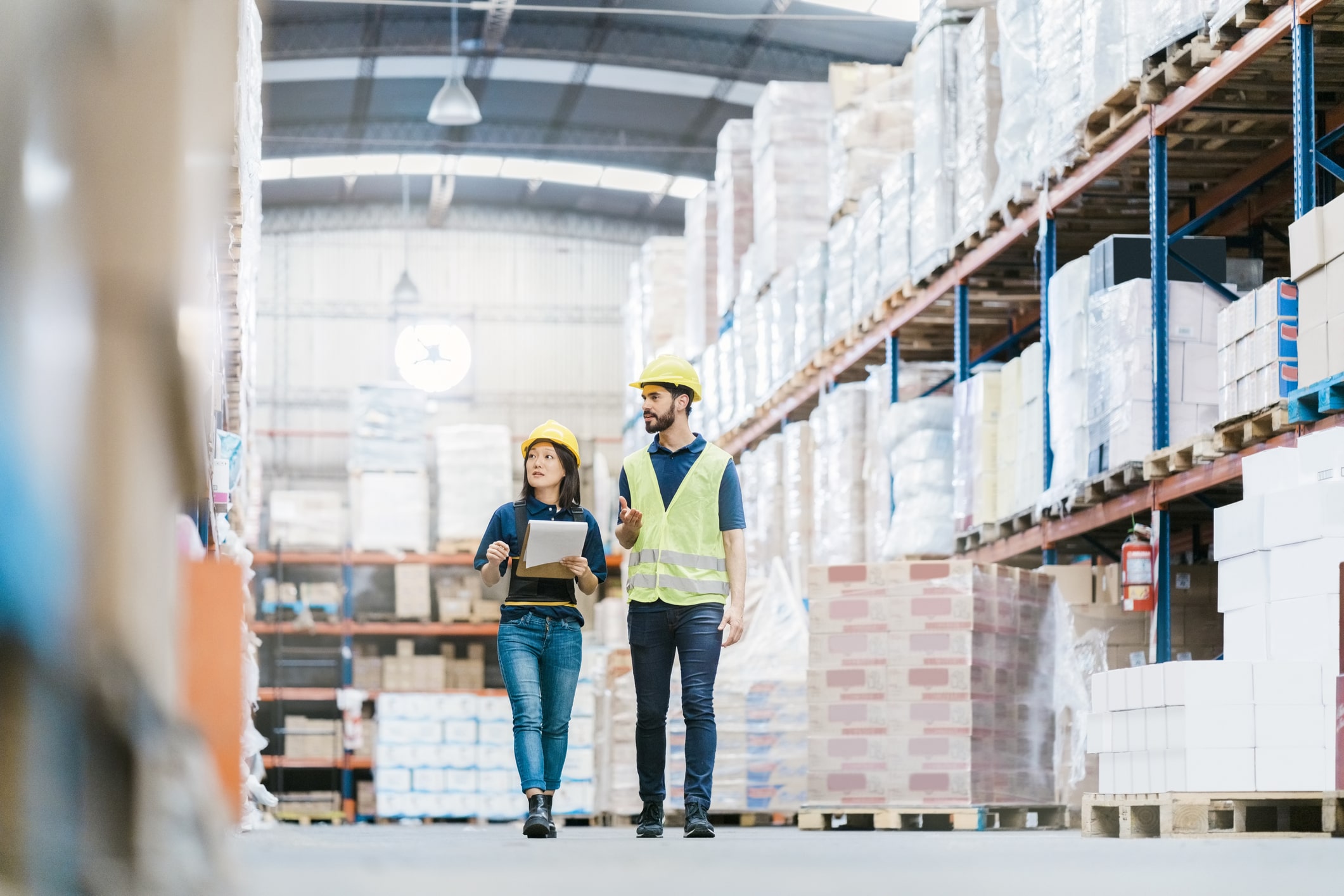 warehouse employees surveying inventory