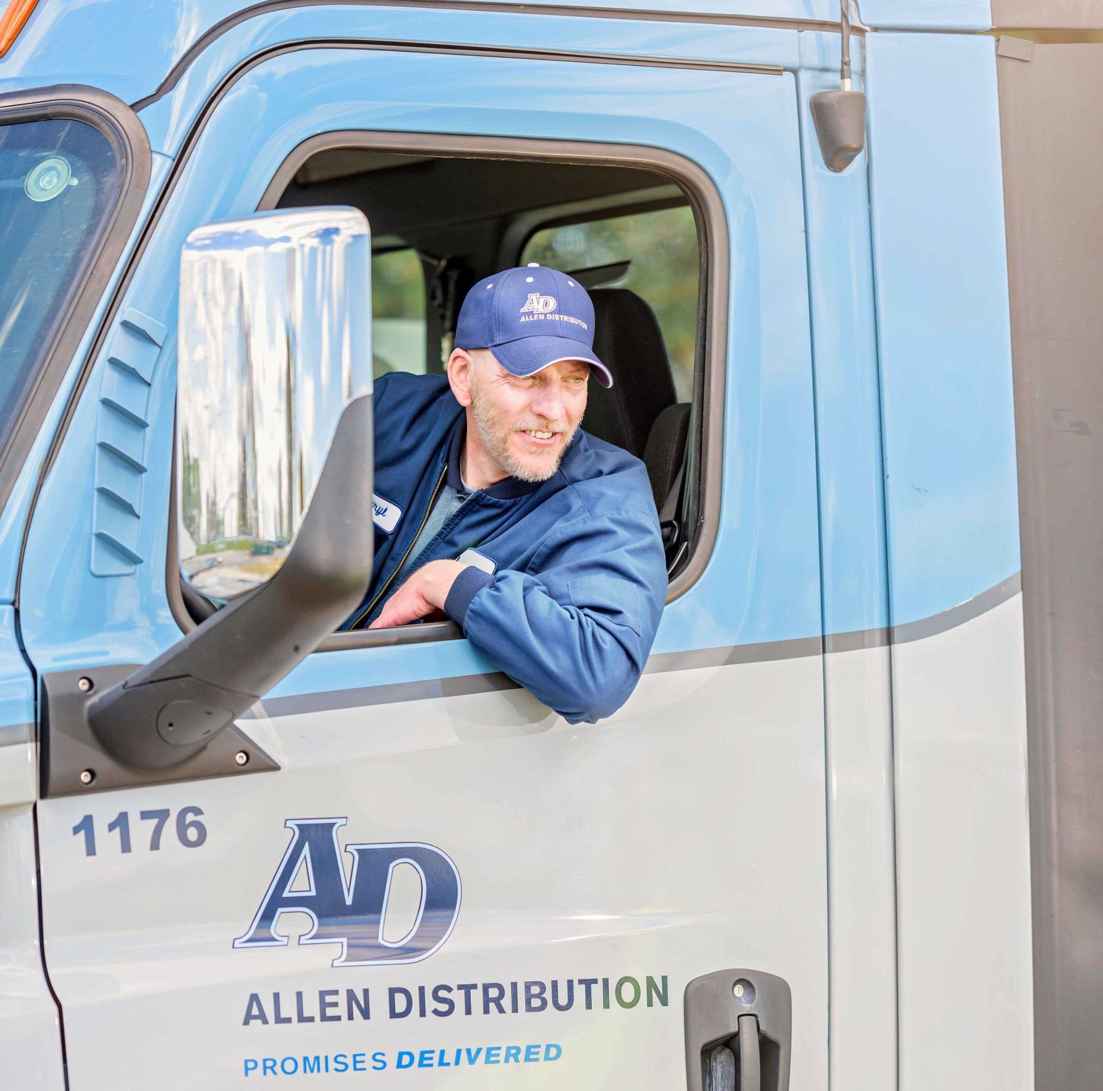 guy leaning out of truck